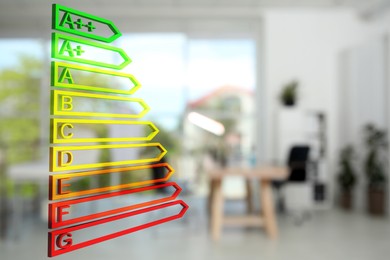 Energy efficiency rating and blurred view of office interior