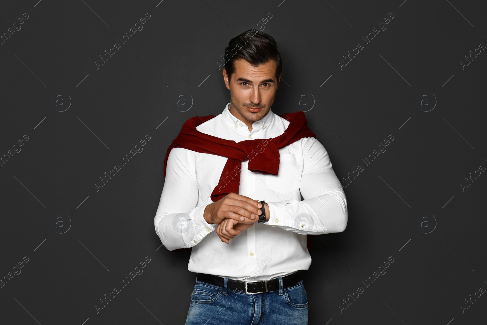 Photo of Portrait of handsome young man on dark background