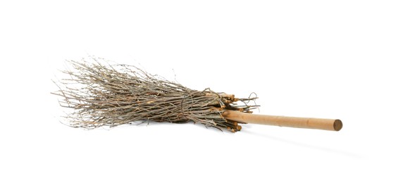 Photo of Old broom with wooden handle isolated on white