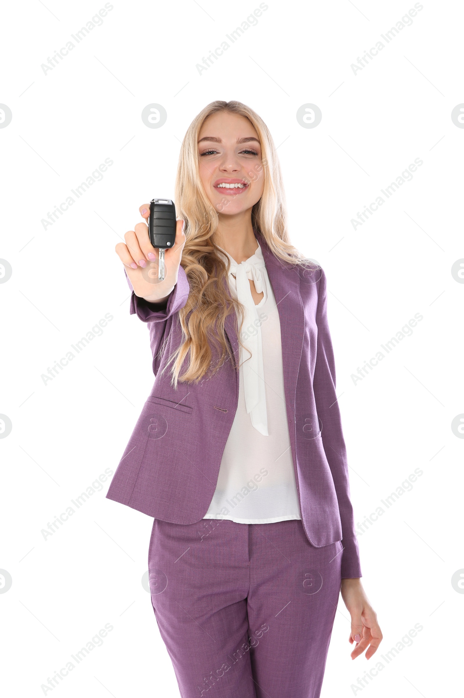 Photo of Happy young businesswoman with car key on white background. Getting driving license