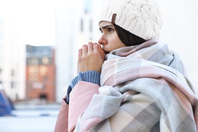 Photo of Sick young woman coughing outdoors. Cold symptom