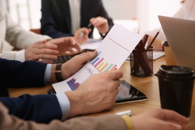 Photo of Businesspeople having meeting in office, closeup. Management consulting