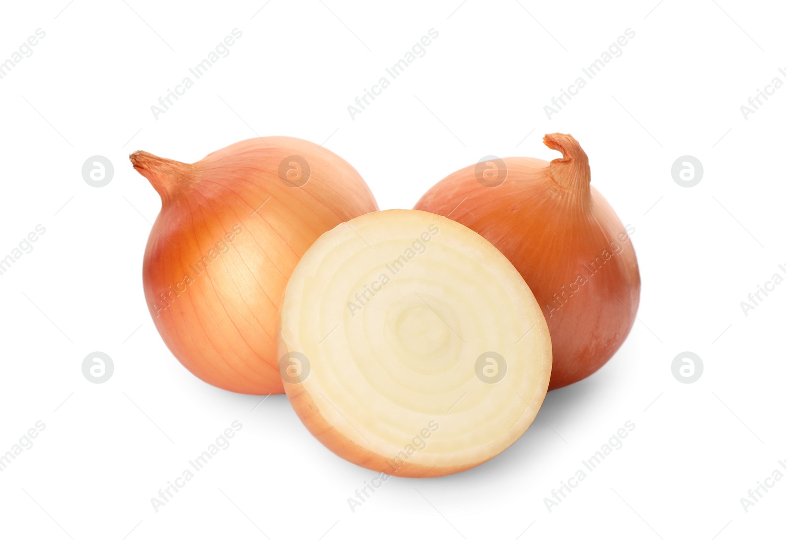 Photo of Whole and cut onions on white background