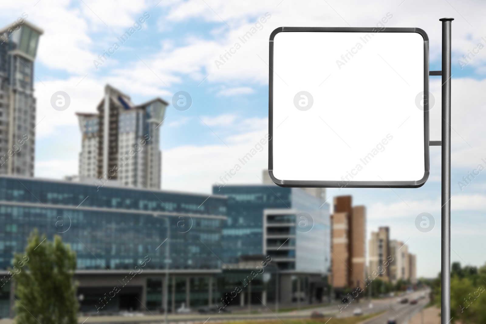 Image of Blank advertising board near road in city. Space for text