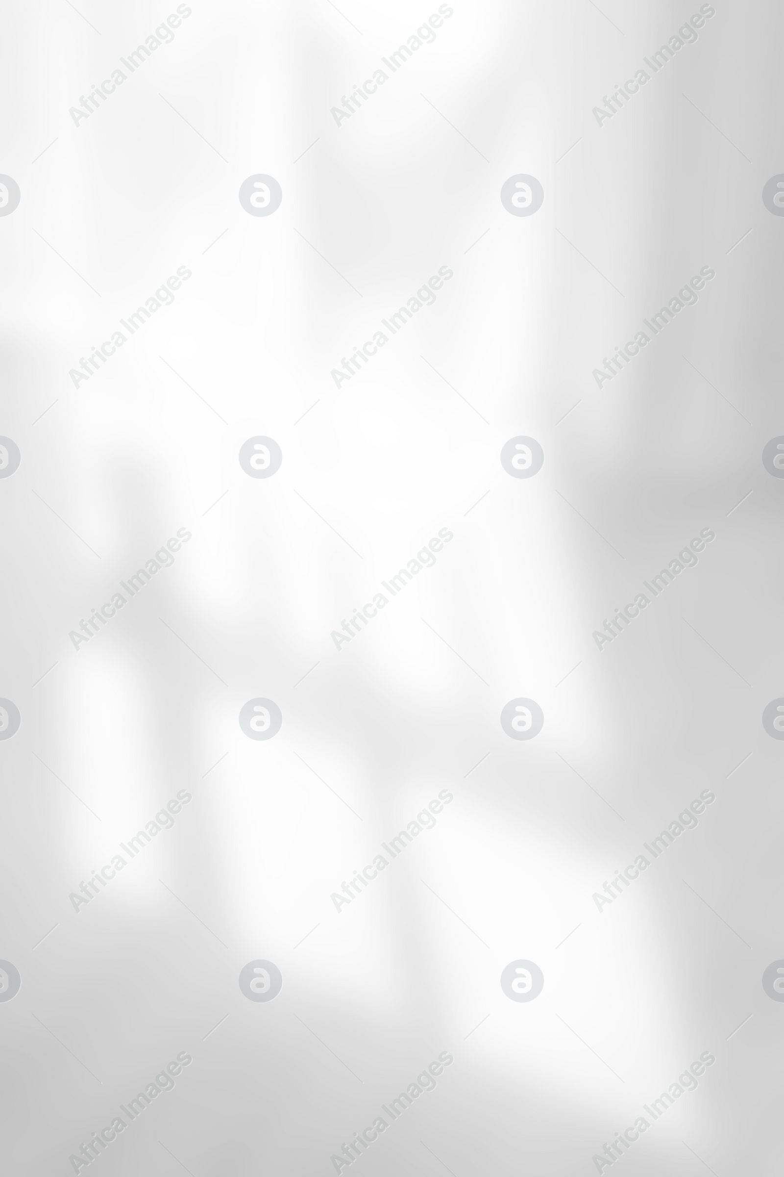 Image of Shadow on white floor in room, blurred view