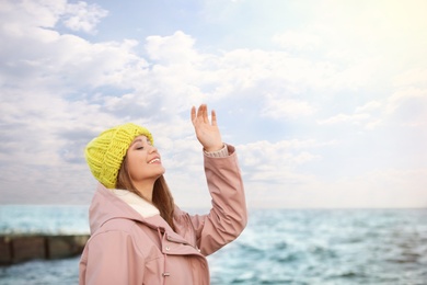 Photo of Portrait of beautiful young woman near sea