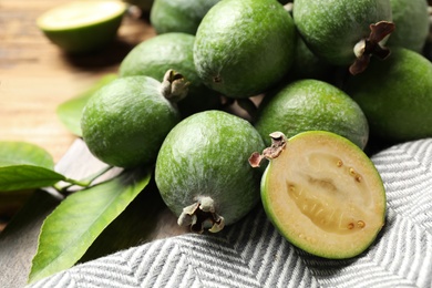 Composition with fresh green feijoa fruits on table, closeup