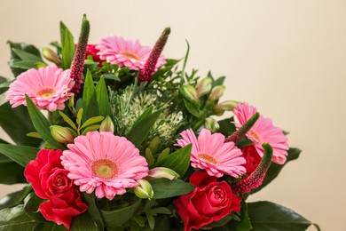 Photo of Bouquet of beautiful flowers on light background, closeup. Space for text