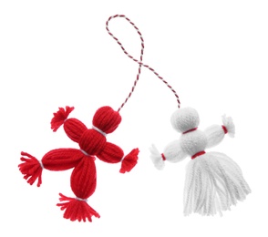 Photo of Traditional martisor shaped as man and woman on white background. Beginning of spring celebration