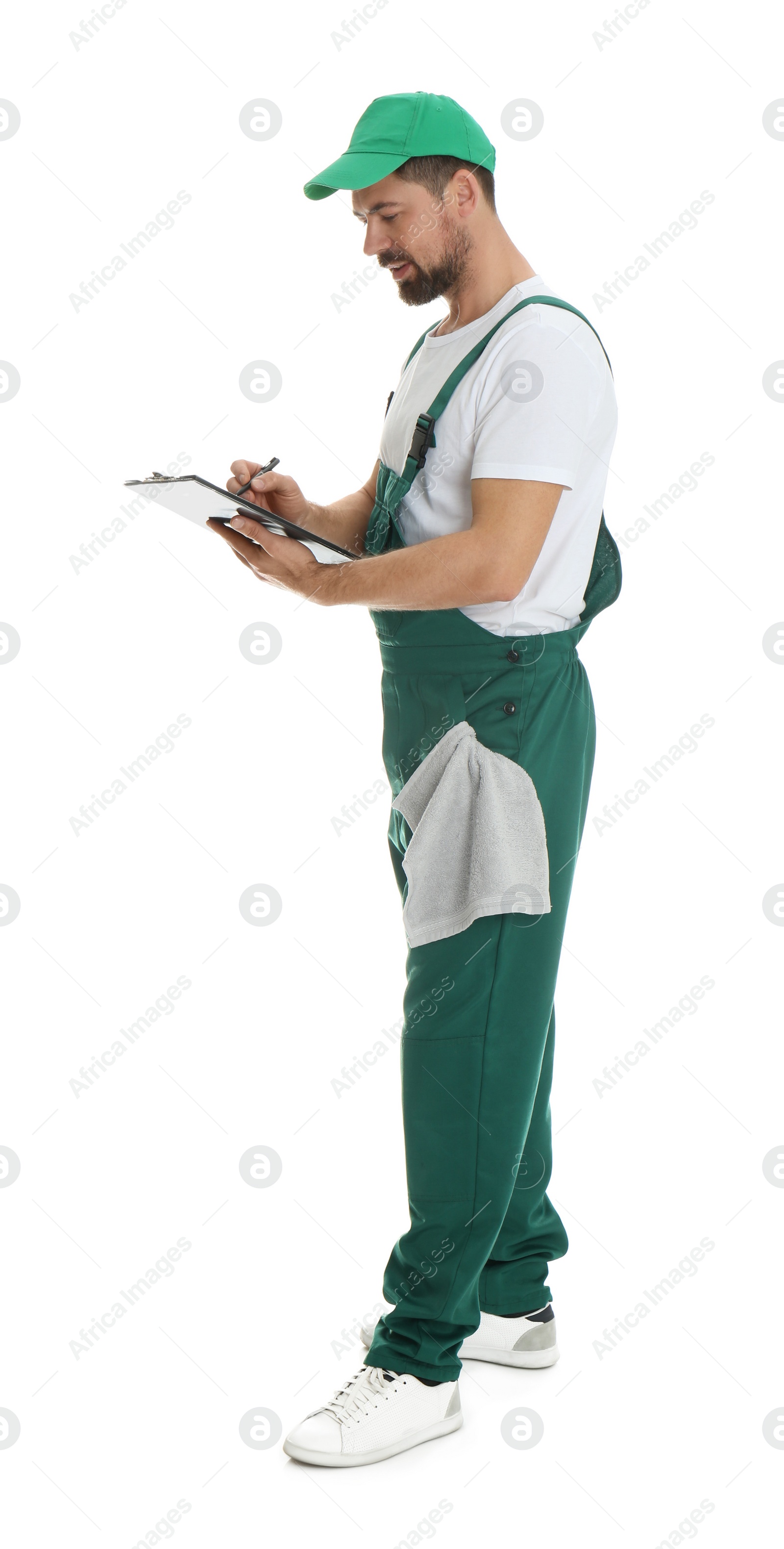 Photo of Full length portrait of professional auto mechanic with clipboard and rag on white background