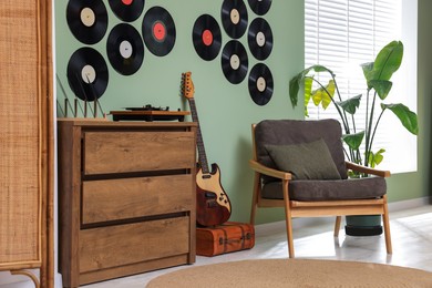 Photo of Living room interior decorated with vinyl records