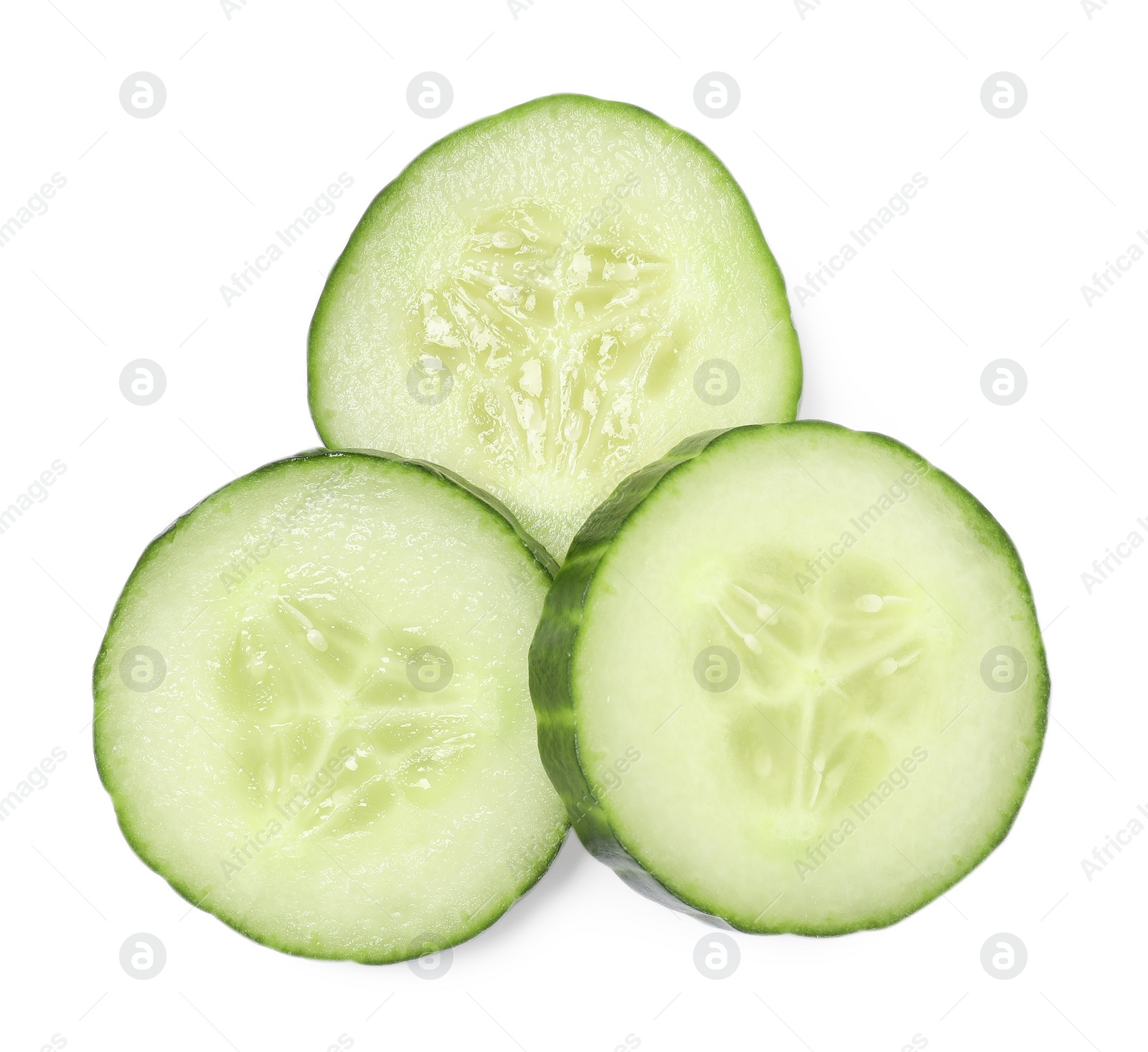 Photo of Slices of fresh cucumber isolated on white, top view