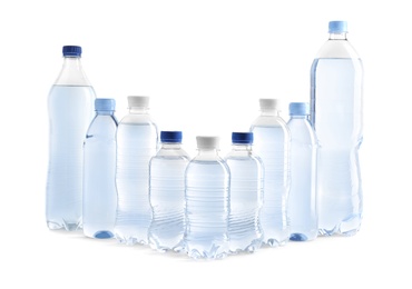 Photo of Set of different plastic bottles with water on white background