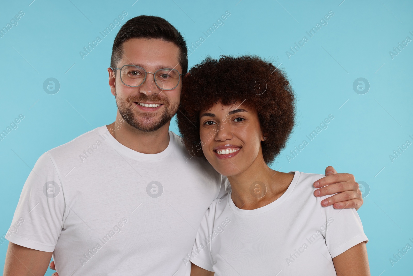 Photo of International dating. Portrait of happy couple on light blue background