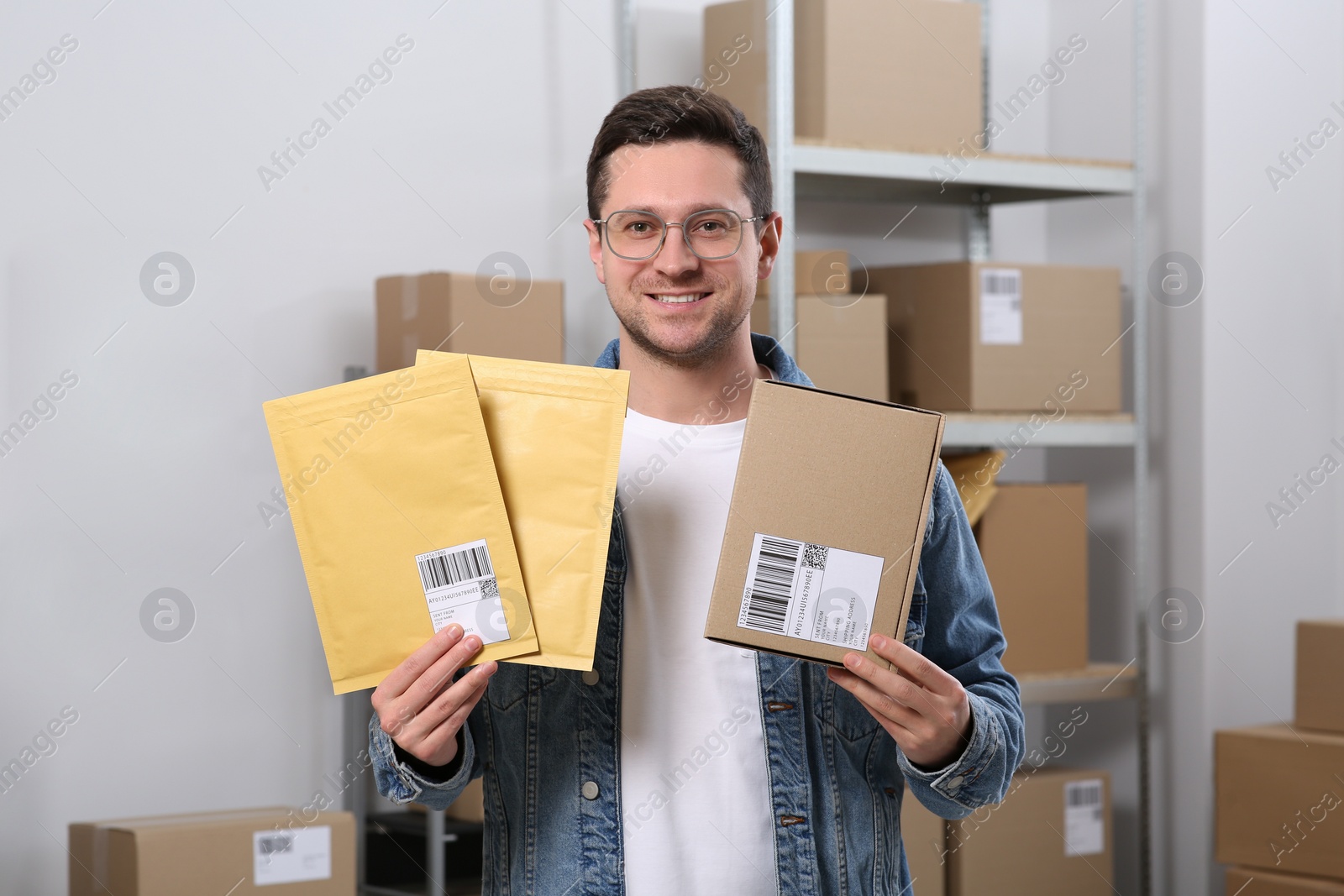 Photo of Seller with parcels in office. Online store