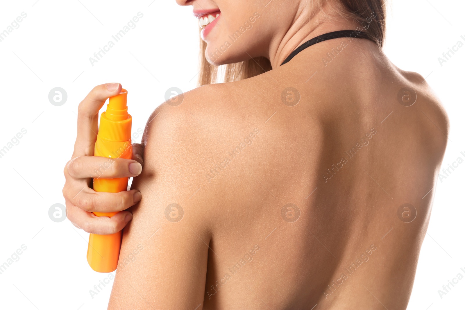 Photo of Woman applying sun protection body cream on white background, closeup