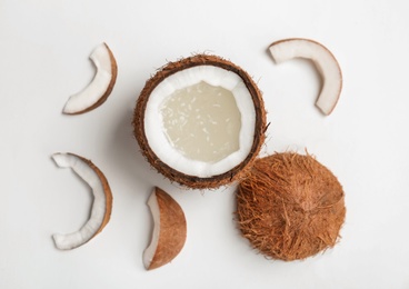 Photo of Coconut water and fresh nuts on white background