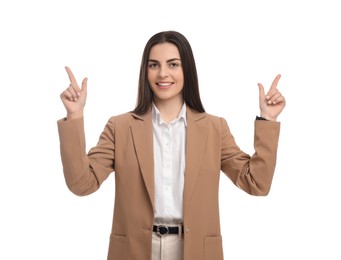 Photo of Beautiful happy businesswoman pointing at something on white background