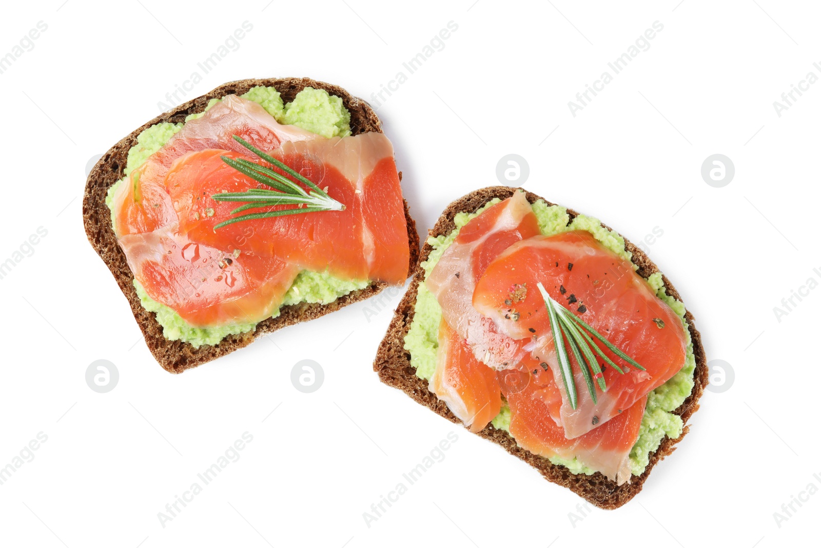 Photo of Delicious sandwiches with salmon, avocado and rosemary on white background, top view