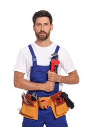 Photo of Professional plumber with pipe wrench and tool belt on white background