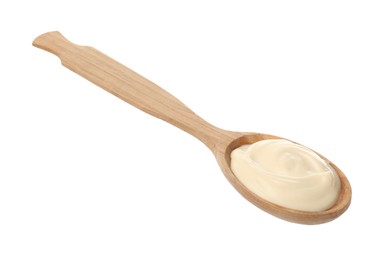 Photo of Wooden spoon with tasty mayonnaise isolated on white