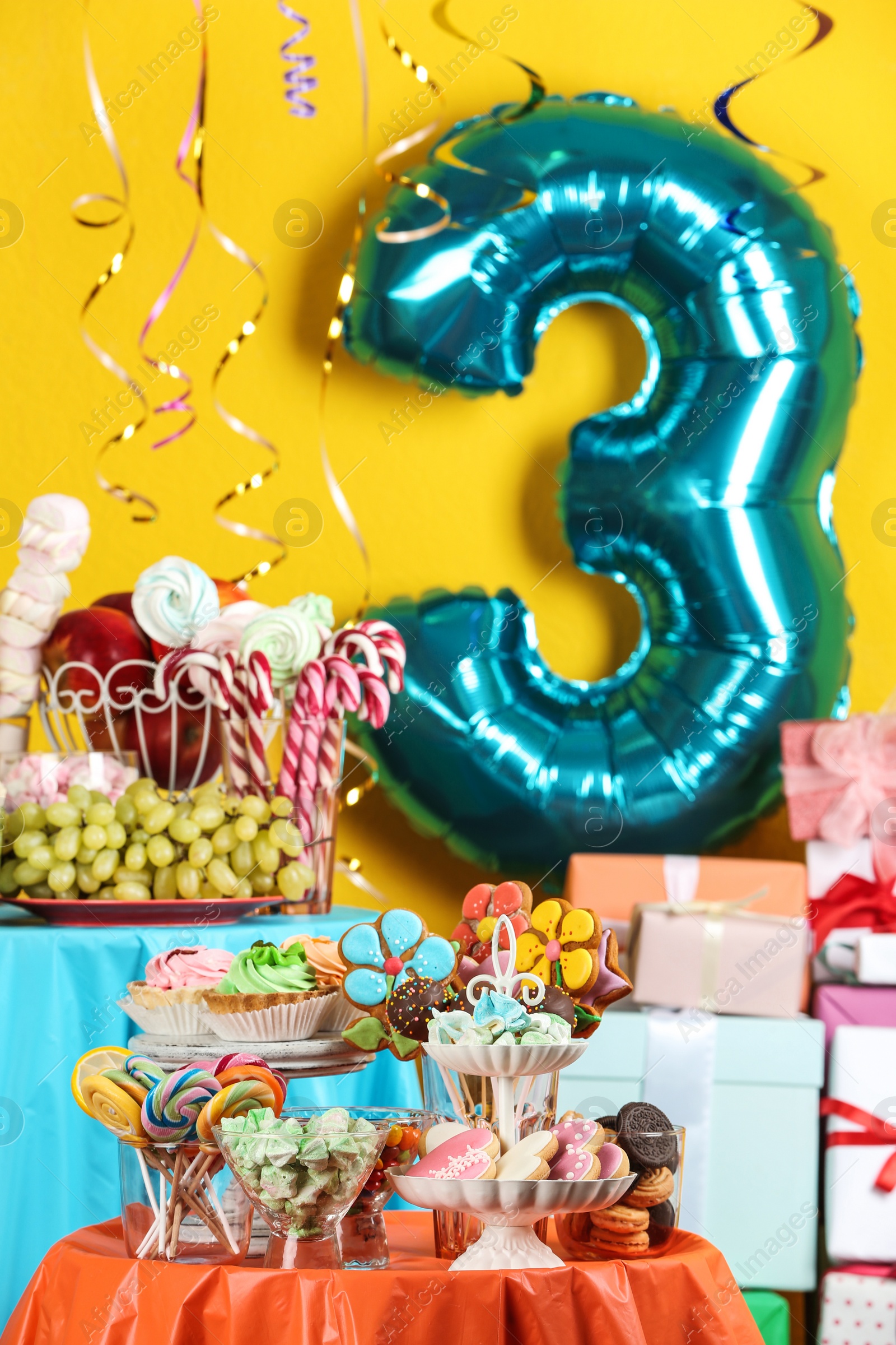 Photo of Dessert table in room decorated with blue balloon for 3 year birthday party