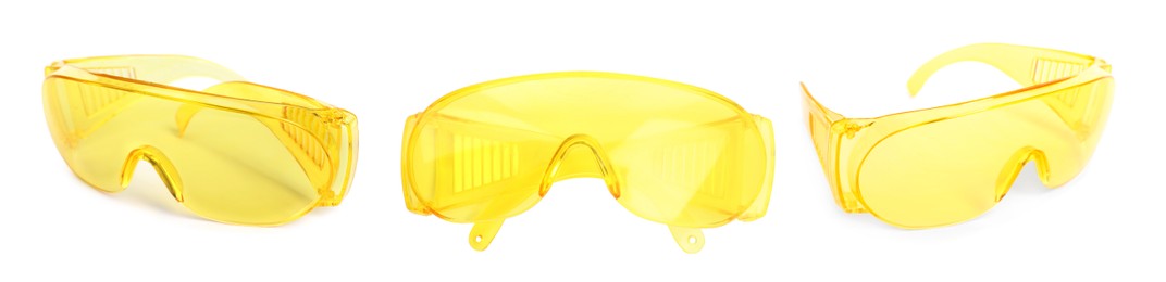 Set with protective goggles on white background, banner design. Safety equipment