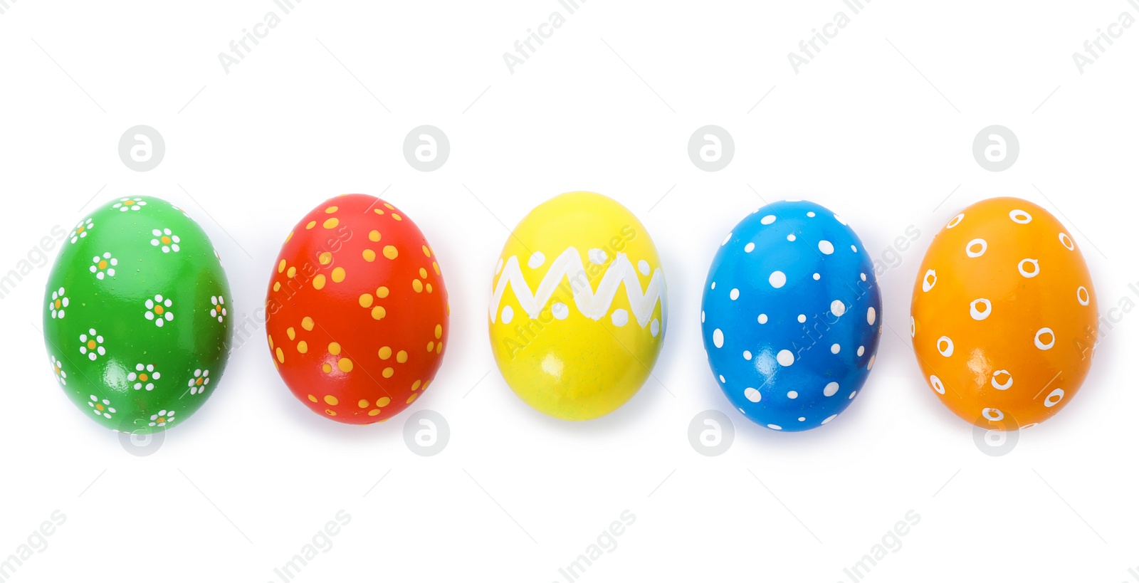 Photo of Decorated Easter eggs on white background, top view. Festive tradition