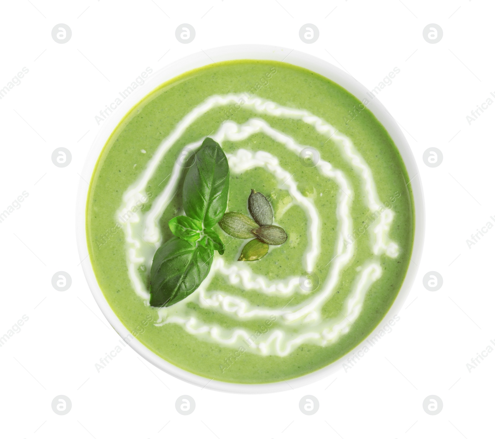 Photo of Delicious broccoli cream soup isolated on white, top view