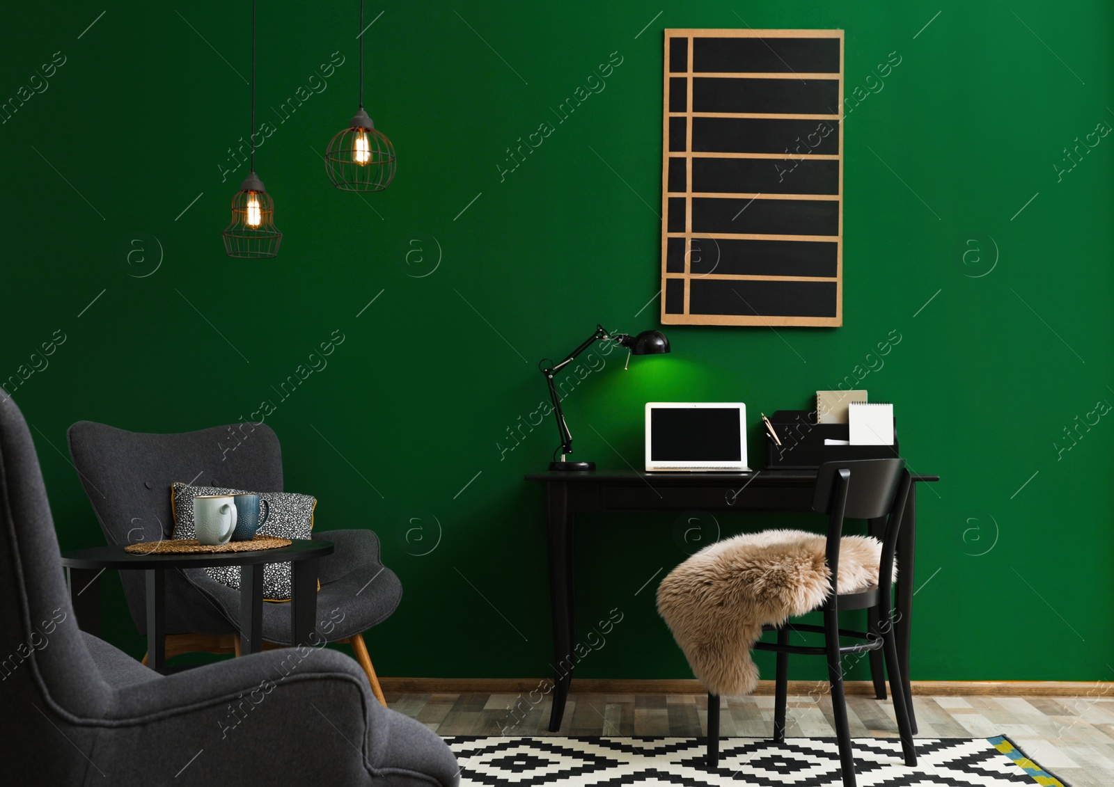 Photo of Modern living room interior with workplace near green wall