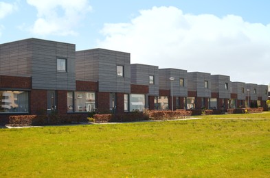 Photo of Block of houses on sunny day. Suburban district