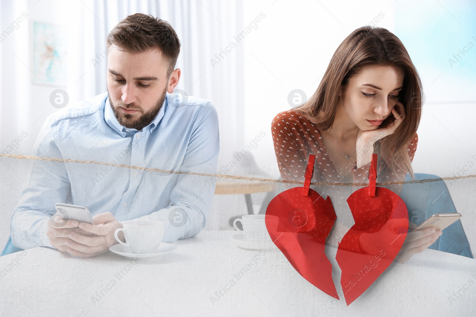 Image of Double exposure with couple addicted to smartphones ignoring each other and halves of torn paper heart pinned on laundry string. Relationship problems