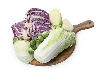 Photo of Wooden board with different types of cabbage isolated on white