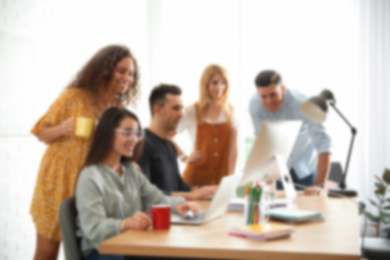 Blurred view of professional interior designers working in office
