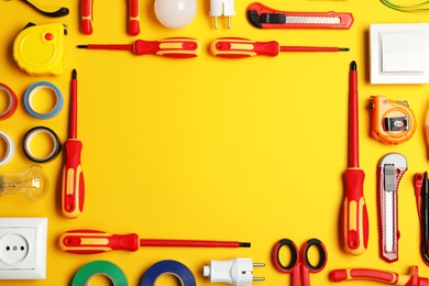 Flat lay composition with electrician's tools and space for text on color background