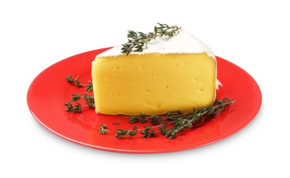 Photo of Plate with piece of tasty camembert cheese and thyme isolated on white