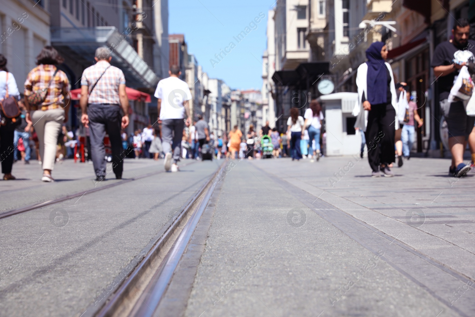 Photo of ISTANBUL, TURKEY - AUGUST 10, 2019: Beautiful city street and people on sunny day, low angle view