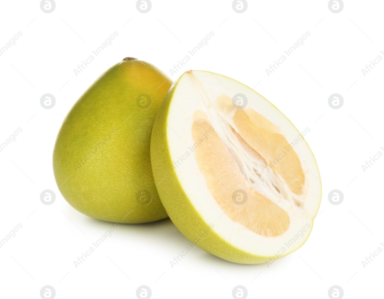 Photo of Fresh cut and whole pomelo fruits isolated on white