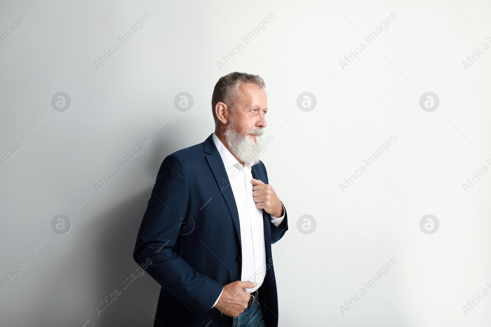 Photo of Portrait of handsome senior man on white background