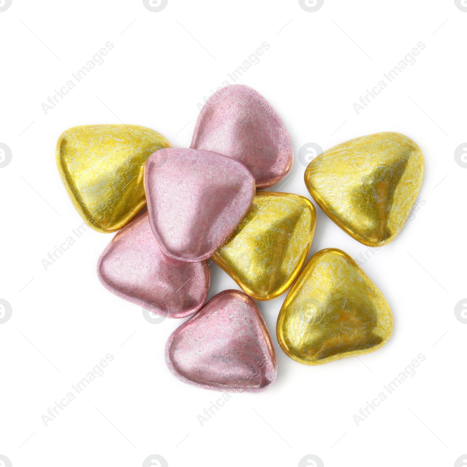 Photo of Many delicious heart shaped candies on white background, top view