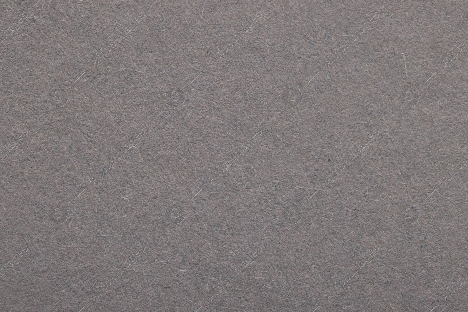 Photo of Texture of grey paper sheet as background, top view