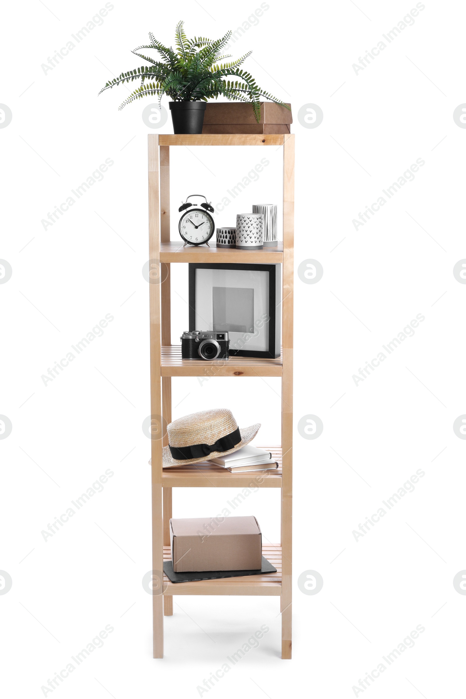 Photo of Wooden shelving unit with different items isolated on white