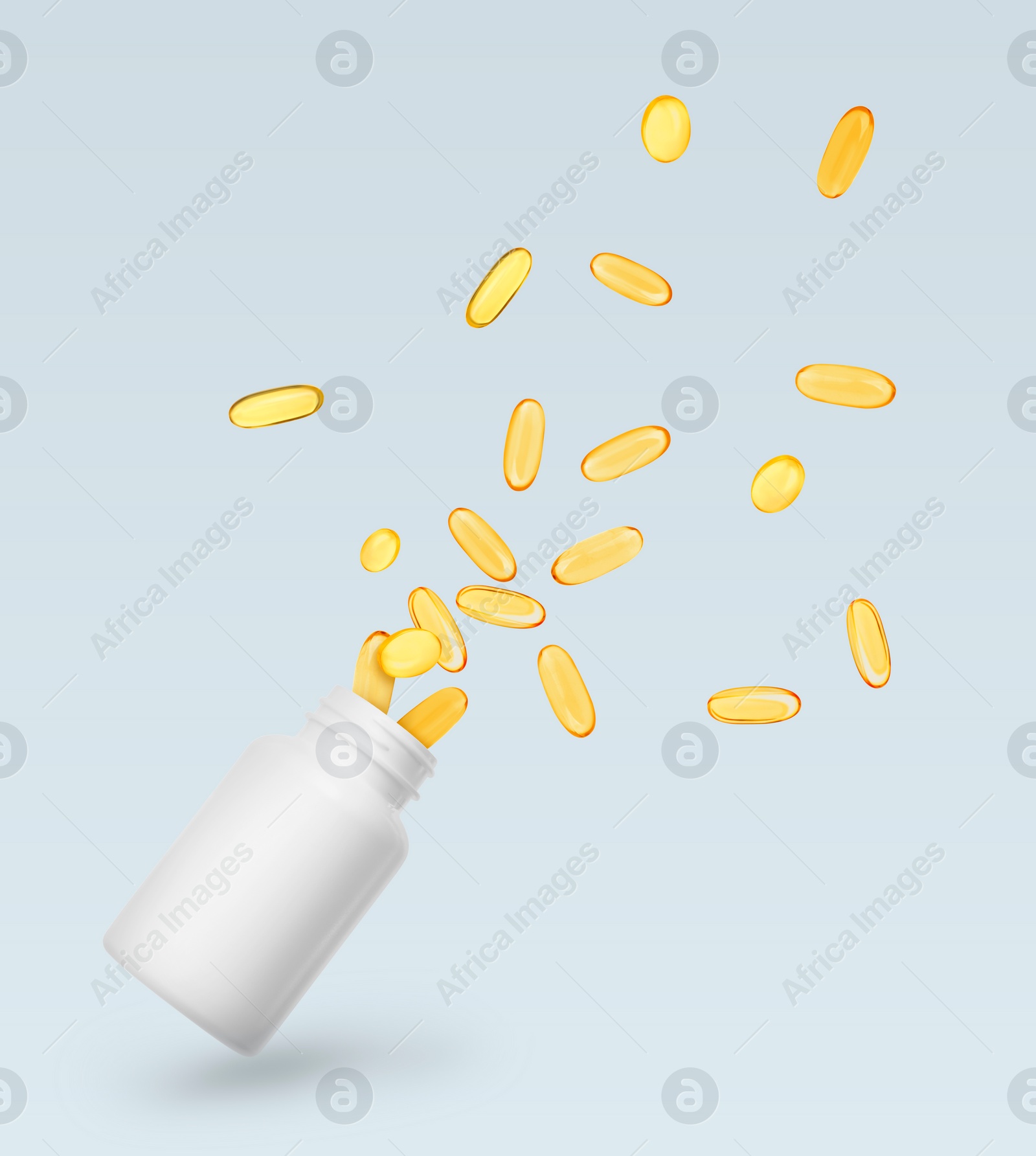 Image of Vitamin. Softgel capsules flying out from bottle on light grey background