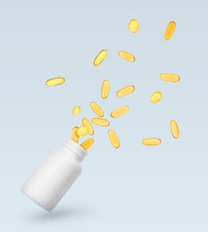 Image of Vitamin. Softgel capsules flying out from bottle on light grey background