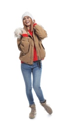 Photo of Young woman wearing warm clothes on white background. Ready for winter vacation