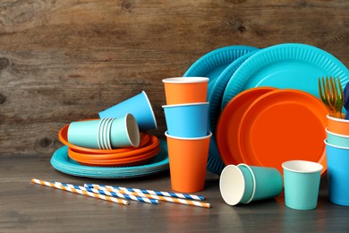 Photo of Setbright disposable tableware on wooden table