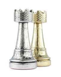 Photo of Silver and golden rooks on white background. Chess pieces