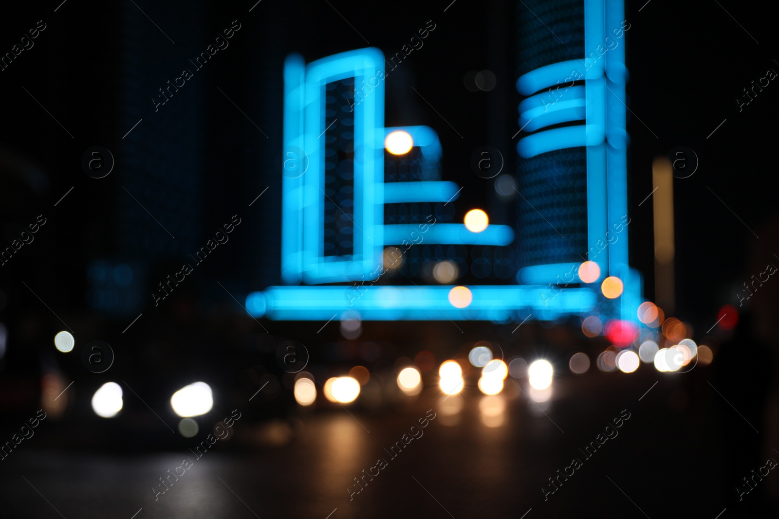 Photo of Blurred view of cityscape with bokeh effect. Night life