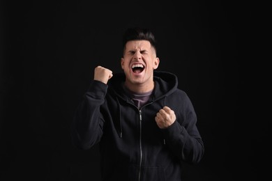 Portrait of emotional man on black background. Personality concept