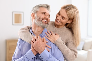 Portrait of happy affectionate couple at home. Romantic date